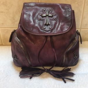 Gently used Purple leather backpack style purse.